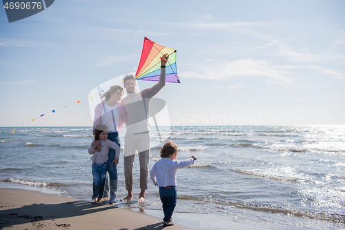 Image of happy family enjoying vecation during autumn day