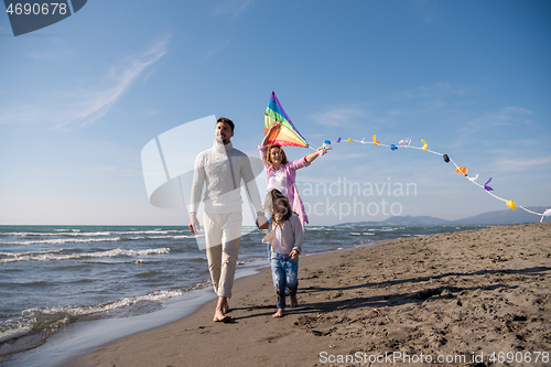 Image of happy family enjoying vecation during autumn day