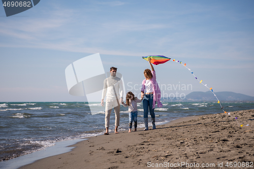 Image of happy family enjoying vecation during autumn day