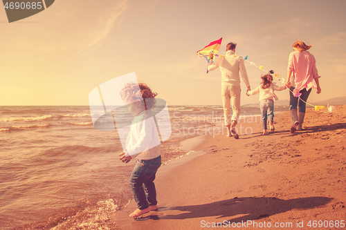 Image of happy family enjoying vecation during autumn day