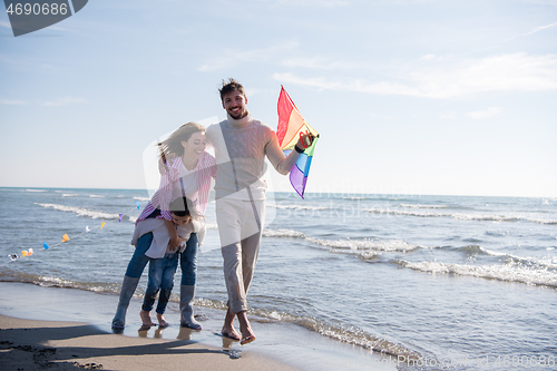 Image of happy family enjoying vecation during autumn day