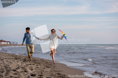 Image of Couple enjoying time together at beach