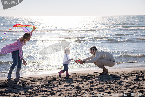 Image of happy family enjoying vecation during autumn day