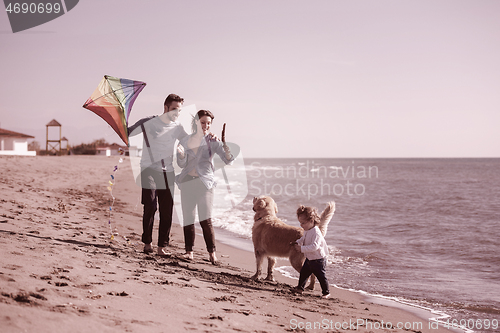 Image of happy young family enjoying vecation during autumn day