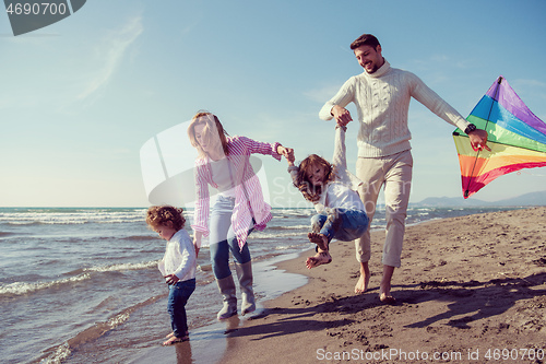 Image of happy family enjoying vecation during autumn day