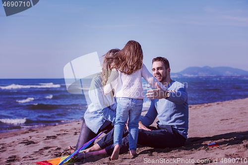 Image of happy family enjoying vecation during autumn day