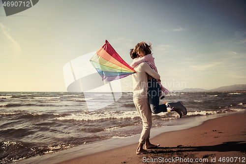 Image of Couple enjoying time together at beach