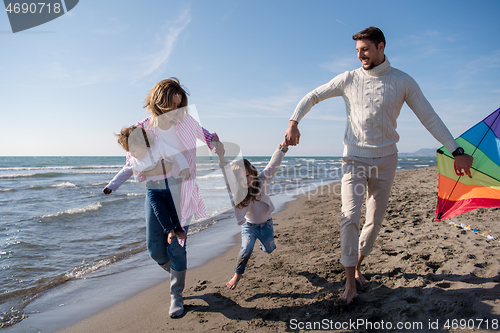 Image of happy family enjoying vecation during autumn day