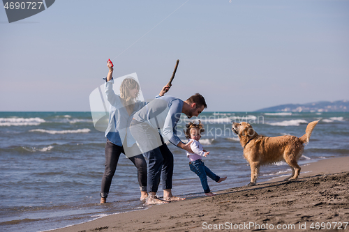 Image of happy young family enjoying vecation during autumn day