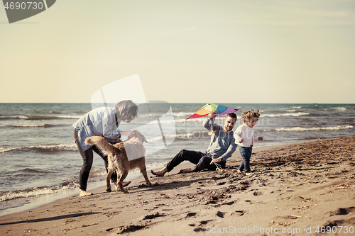 Image of happy young family enjoying vecation during autumn day