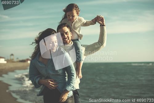 Image of Young family enjoying vecation during autumn