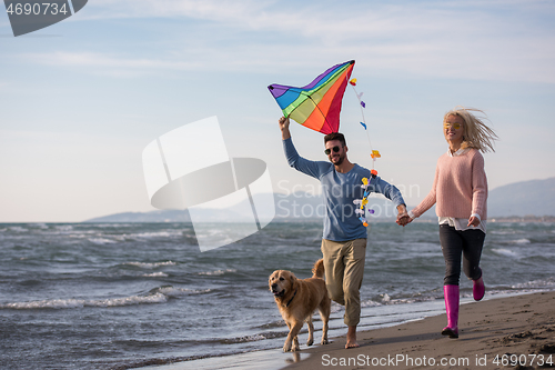 Image of happy couple enjoying time together at beach