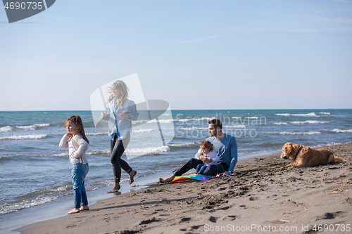 Image of happy young family enjoying vecation during autumn day