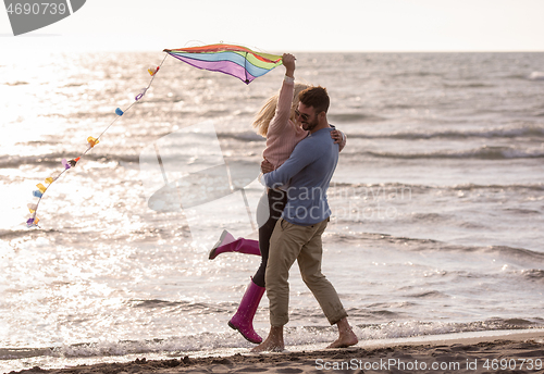 Image of Couple enjoying time together at beach