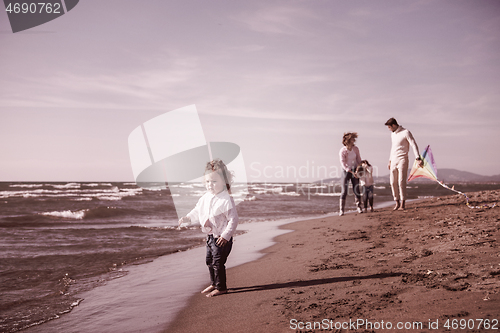 Image of happy family enjoying vecation during autumn day