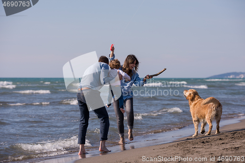 Image of happy young family enjoying vecation during autumn day