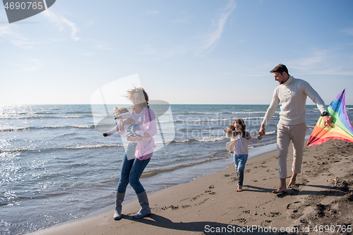 Image of happy family enjoying vecation during autumn day