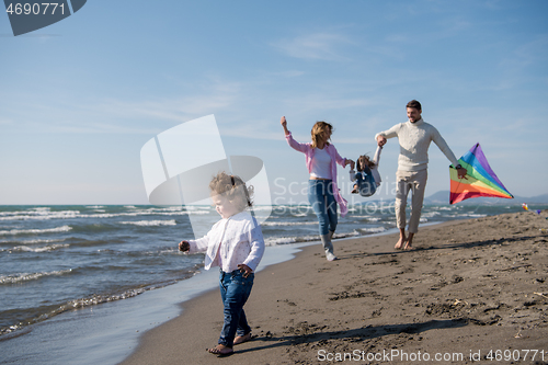 Image of happy family enjoying vecation during autumn day