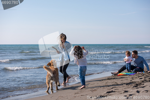 Image of happy young family enjoying vecation during autumn day