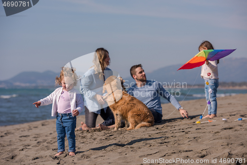 Image of happy young family enjoying vecation during autumn day