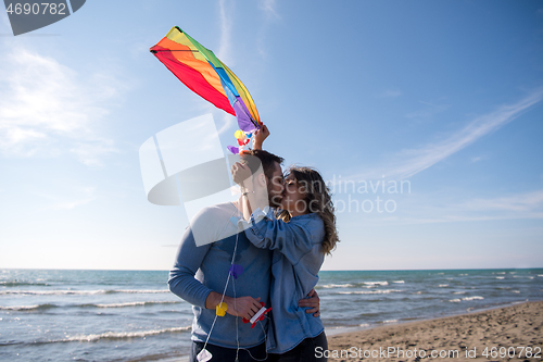 Image of Couple enjoying time together at beach