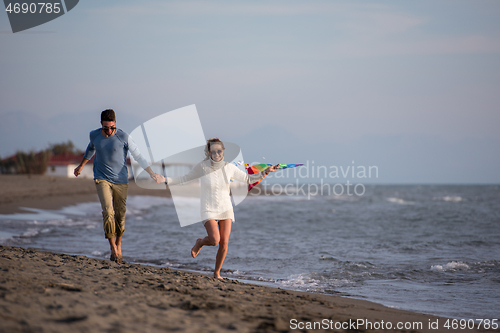 Image of Couple enjoying time together at beach