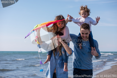 Image of happy family enjoying vecation during autumn day