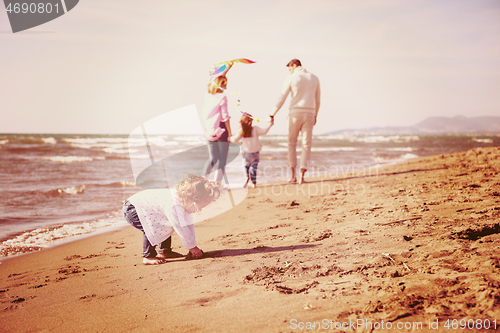 Image of happy family enjoying vecation during autumn day