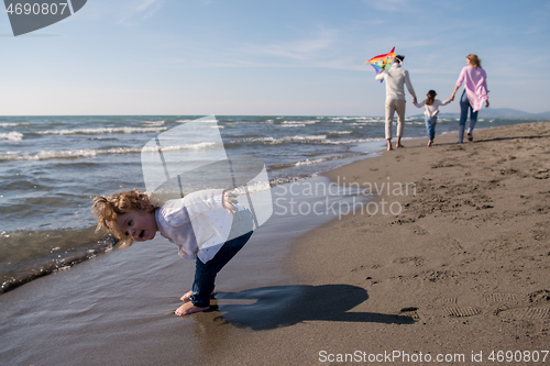 Image of happy family enjoying vecation during autumn day