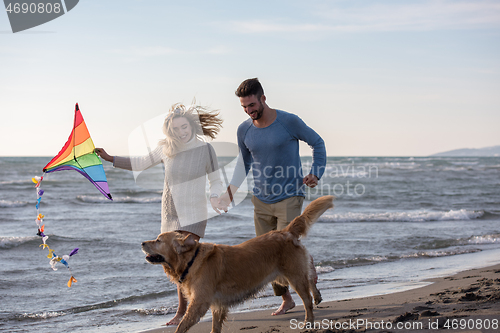 Image of happy couple enjoying time together at beach