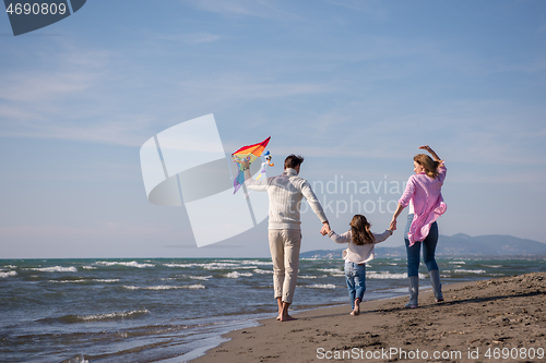 Image of happy family enjoying vecation during autumn day