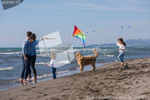 Image of happy young family enjoying vecation during autumn day