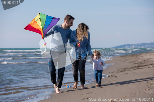 Image of happy family enjoying vecation during autumn day