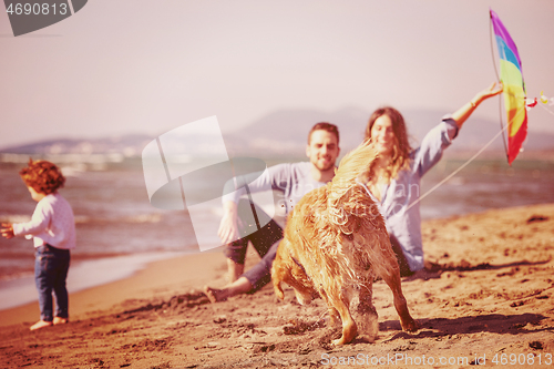 Image of happy young family enjoying vecation during autumn day