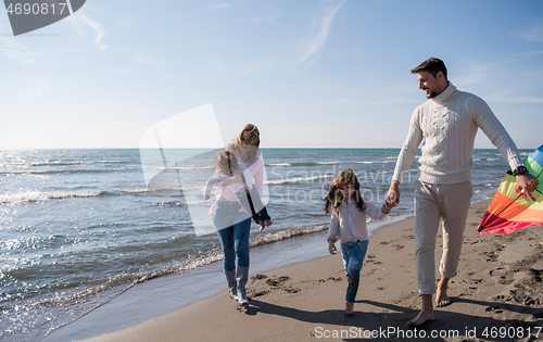 Image of happy family enjoying vecation during autumn day