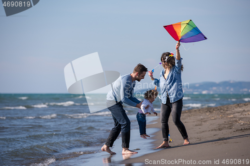 Image of happy family enjoying vecation during autumn day