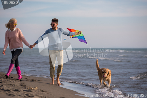 Image of happy couple enjoying time together at beach