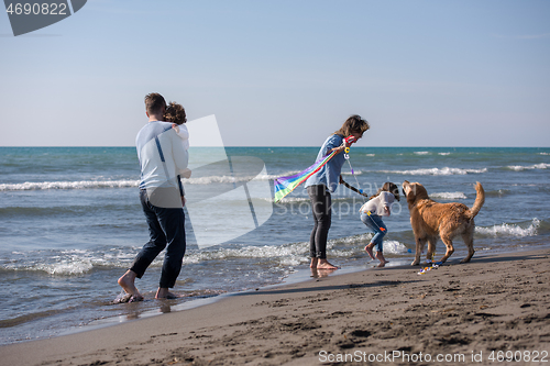 Image of happy young family enjoying vecation during autumn day