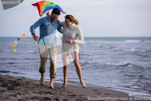 Image of Couple enjoying time together at beach