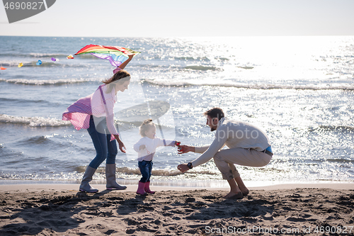 Image of happy family enjoying vecation during autumn day