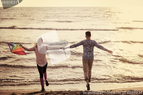 Image of Couple enjoying time together at beach