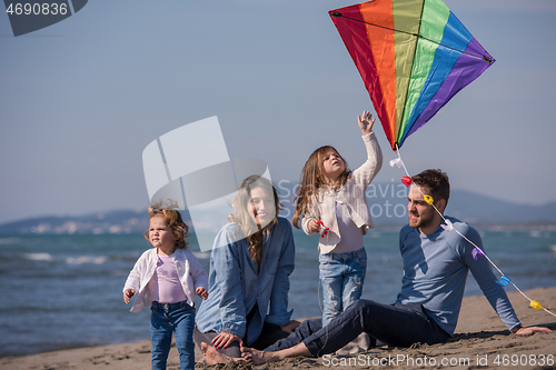 Image of happy family enjoying vecation during autumn day