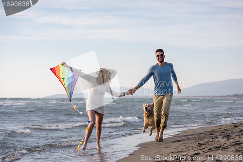 Image of happy couple enjoying time together at beach