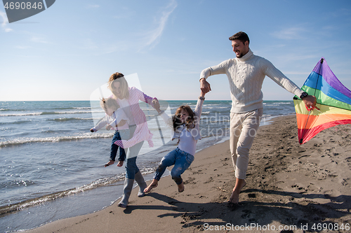 Image of happy family enjoying vecation during autumn day