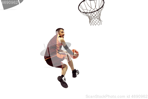 Image of Full length portrait of a basketball player with ball