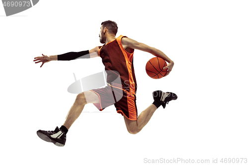 Image of Full length portrait of a basketball player with ball