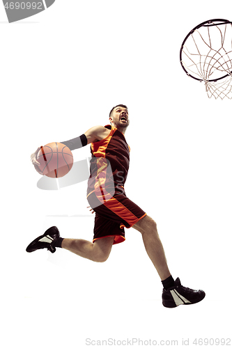 Image of Full length portrait of a basketball player with ball