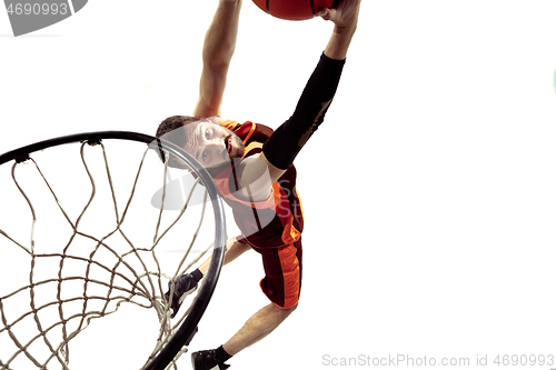 Image of Full length portrait of a basketball player with ball