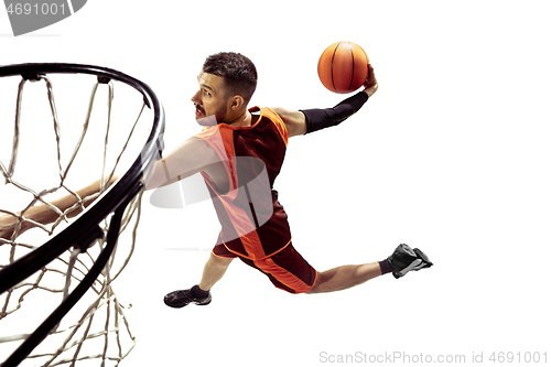 Image of Full length portrait of a basketball player with ball