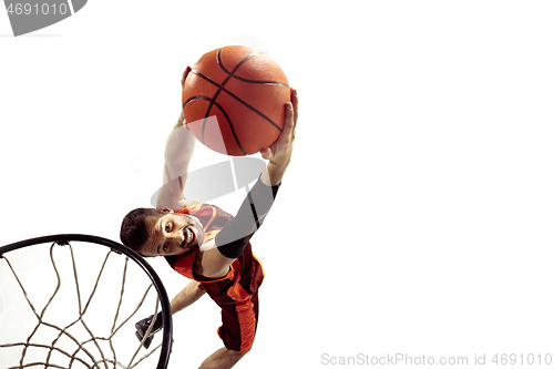 Image of Full length portrait of a basketball player with ball